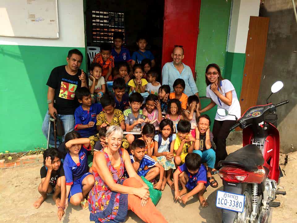 The Cambodia Sings team with a group of children outside a school
