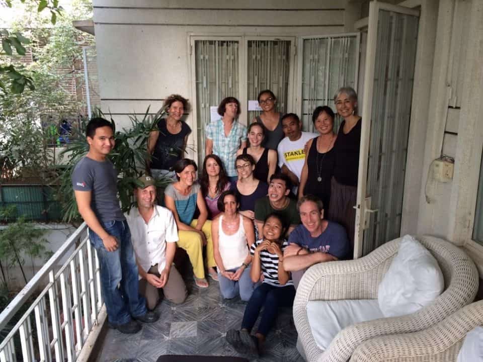 Community choir members gathered on a Phnom Penh balcony